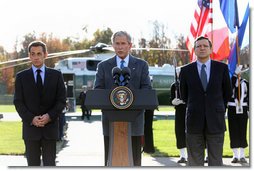 President George W. Bush is joined by French President Nicolas Sarkozy, left, and Jose Manuel Barroso, President of the European Commission as he addresses the media during a meeting at Camp David concerning the economic crisis and the need for coordinated global response Saturday, October 18, 2008.  White House photo by Chris Greenberg