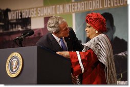 After being introduced President George W. Bush embraces Liberian President Ellen Johnson Sirleaf at the White House Summit Tuesday, Oct. 21, 2008, in Washington, D.C. President Bush discussed in his remarks core transformational goals of country ownership, good governance, results-based programs and accountability, and the importance of economic growth. White House photo by Eric Draper