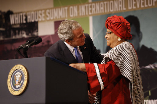 After being introduced President George W. Bush embraces Liberian President Ellen Johnson Sirleaf at the White House Summit Tuesday, Oct. 21, 2008, in Washington, D.C. President Bush discussed in his remarks core transformational goals of country ownership, good governance, results-based programs and accountability, and the importance of economic growth. White House photo by Eric Draper