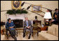 President George W. Bush and Liberia President Ellen Johnson Sirleaf talk with reporters following their meeting Wednesday, Oct. 22, 2008, in the Oval Office at the White House. President Bush said during his remarks, "Liberia needs the help of the United States and other nations to help make sure children are educated, to make sure babies are not dying because of malaria, to make sure there's an infrastructure so that small businesses can flourish, to make sure port is open for business. We have been helpful and we want to be helpful in the future." White House photo by Eric Draper