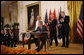 President George W. Bush is joined on stage by Croatian Ambassador to the U.S. Kolinda Grabar-Kitarovic, left, Albanian Ambassador to the U.S. Aleksander Saliabanda and NATO Secretary General Jaap De Hoop Scheffer, right, as he signs the NATO accession protocols Friday, Oct. 24, 2008 in the East Room of the White House, in support of the nations of Albania and Croatia to join the NATO alliance. When all 26 NATO allies have ratified the accession protocols Albania and Croatia will be eligible to join NATO. White House photo by Eric Draper