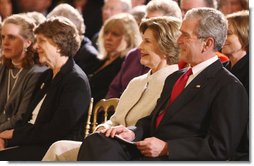 President George W. Bush and Mrs. Laura Bush listen Monday evening, Oct. 27, 2008 in the East Wing of the White House, to the performance of Theodore Roosevelt impersonator Joe Wiegand, during a celebration of the 150th birthday of Theodore Roosevelt. White House photo by Chris Greenberg