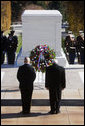 Vice President Dick Cheney stands in silence after placing a wreath at the Tomb of the Unknowns Tuesday, Nov. 11, 2008 during the 55th Annual National Veterans Day Observance at Arlington National Cemetery in Arlington, Va. Standing with the Vice President is Major General Richard J. Rowe Jr., commander of the Military District of Washington. White House photo by David Bohrer