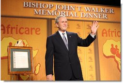 President George W. Bush waves as he acknowledges applause following his remarks Wednesday evening, Nov. 12, 2008, at the 2008 Bishop John T. Walker Memorial Dinner in Washington, D.C., where President Bush was honored with the Bishop John T. Walker Distinguished Humanitarian Service Award from Africare.  White House photo by Chris Greenberg