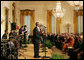 Mrs. Laura Bush listens as Berklee City Music group performs Friday, Nov. 14, 2008, during the Coming Up Taller Awards in the East Room of the White House. White House photo by Joyce N. Boghosian