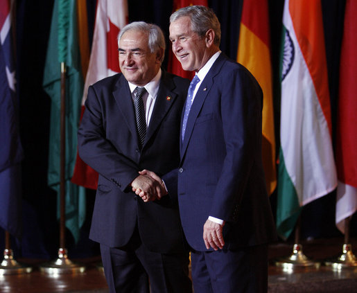 President George W. Bush welcomes Mr. Dominique Strauss-Kahn, Managing Director of the International Monetary Fund, to the Summit on Financial Markets and the World Economy Saturday, Nov. 15, 2008, at the National Building Museum in Washington, D.C. White House photo by Eric Draper