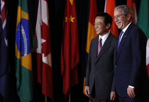 President George W. Bush welcomes Prime Minister Taro Aso of Japan, to the Summit on Financial Markets and the World Economy Saturday, Nov. 15, 2008, at the National Building Museum in Washington, D.C. White House photo by Eric Draper