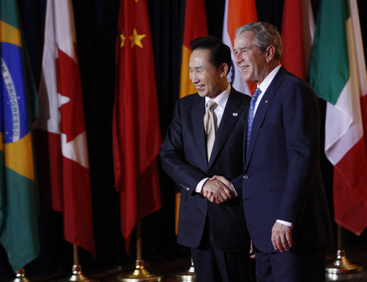 President George W. Bush welcomes President Lee Myung-bak of the Republic of South Korea, to the Summit on Financial Markets and the World Economy Saturday, Nov. 15, 2008, at the National Building Museum in Washington, D.C. White House photo by Eric Draper