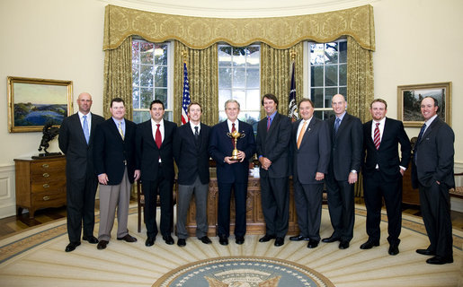 President George W. Bush stands with members of the U.S. Ryder Cup Team Monday, Nov. 17, 2008, in the Oval Office of the White House. The Ryder Cup is awarded biennially in a golf championship between the United States and Europe. The U.S. won the 2008 Cup by five points in September, the largest margin of victory since 1981. White House photo by Chris Greenberg