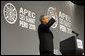 President George W. Bush waves to the audience after delivering his address to the APEC CEO Summit 2008 in Lima, Peru. Said the President in wrapping up his remarks, "Thanks for letting me come by. Que Dios le bendiga. God bless." White House photo by Eric Draper