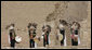 Greeters in traditional clothing welcome the APEC spouses to the Pachacamac Archaeological Site in Lurin, Peru, Saturday, Nov. 22, 2008, during the APEC spouses program. The site is home to the temples of the deity, Pachacamac, who was adored by Andean civilizations as the creator of the universe. Pachacamac means: "He who enlivens the universe." White House photo by Joyce N. Boghosian