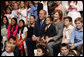 President George W. Bush and Mrs. Laura Bush sit for a photo with the children of U.S. Embassy staff Sunday, Nov. 23, 2008, in Lima. Peru. White House photo by Eric Draper