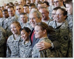 President George W. Bush stands with troops on stage Tuesday, Nov. 25, 2008, at Fort Campbell, Ky., one of the Army's premier training and deployment installations and home of the Screaming Eagles of the 101st Airborne. White House photo by Eric Draper