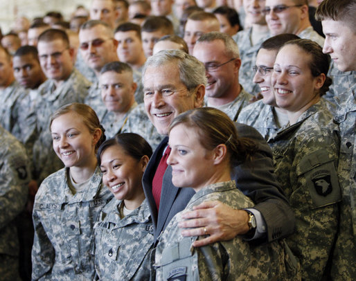 President George W. Bush stands with troops on stage Tuesday, Nov. 25, 2008, at Fort Campbell, Ky., one of the Army's premier training and deployment installations and home of the Screaming Eagles of the 101st Airborne. White House photo by Eric Draper