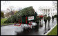 Sue Harman drives a horse-drawn carriage delivering the official White House Christmas tree Sunday, Nov. 30, 2008, to the North Portico of the White House. The Fraser Fir tree, from River Ridge Farms in Crumpler, N.C., will be on display in the Blue Room of the White House for the 2008 Christmas season. White House photo by Chris Greenberg