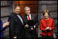 President George W. Bush, joined by Mrs. Laura Bush, is presented with the International Medal of PEACE by Pastor Rick Warren, Monday, Dec. 1, 2008, following their participation at the Saddleback Civil Forum on Global Health in Washington, D.C. White House photo by Eric Draper