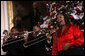 A vocalist with Sweet Heaven Kings entertains in the East Room of the White House Monday, Dec. 8, 2008, during the 2008 Children's Holiday Reception and Performance hosted by President George W. Bush and Mrs. Laura Bush. The Sweet Heaven Kings is the premier brass band at the United House of Prayer in Anacostia, Washington, D.C. White House photo by Eric Draper