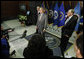 President George W. Bush delivers remarks during his visit to the National Counterterrorism Center Monday, Dec. 8, 2008, in McLean, VA. President Bush is joined by Counterterrorism Director Mike Leiter, left, and National Intelligence Director Mike McConnell. White House photo by Eric Draper