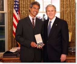 President George W. Bush stands with Dr. Mitch Besser after presenting him with the 2008 Presidential Citizens Medal Wednesday, Dec. 10, 2008, in the Oval Office of the White House. White House photo by Chris Greenberg