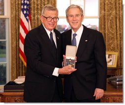 President George W. Bush stands with Chuck Colson after presenting him with the 2008 Presidential Citizens Medal Wednesday, Dec. 10, 2008, in the Oval Office of the White House. White House photo by Chris Greenberg