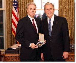 President George W. Bush stands with Dr. Don Landry after presenting him with the 2008 Presidential Citizens Medal Wednesday, Dec. 10, 2008, in the Oval Office of the White House. White House photo by Chris Greenberg