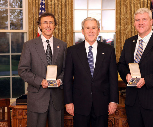 President George W. Bush stands with Jeff Miller and Earl Morse after presenting them with the 2008 Presidential Citizens Medal Wednesday, Dec. 10, 2008, in the Oval Office of the White House. White House photo by Chris Greenberg