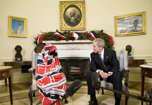 Marking International "Human Rights Day," President George W. Bush meets with Dr. Halima Bashir, a Darfur Human Rights Activist in the Oval Office of the White House. President Bush said Dr. Bashir, the author of "Tears of the Desert," "This good soul brings firsthand accounts to what life is like in Darfur. She has witnessed violence, deprivation, and she carries a message of a lot of people who want our help." White House photo by Chris Greenberg