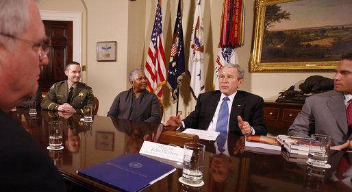 President George W. Bush speaks to participants during a meeting on drug use reduction Thursday, Dec. 11, 2008, in the Roosevelt Room of the White House. Listening in are, from left: Lt. Mike Boudreaux, Narcotics Commander, Tulare County Sheriff's Department, Visalia, Calif.; Janice Dessaso Gordon, co-founder, Community Action Group, Washington, D.C., and Josh Hamilton, outfielder with the Texas Rangers. John Walters, Director of the Office of National Drug Control Policy, is in foreground at left. White House photo by Chris Greenberg