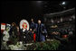 President George W. Bush waves as he leaves the stage following his commencement address at Texas A&M University's winter convocation Friday, Dec. 12, 2008, in College Station, Texas. White House photo by Eric Draper