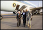 President George W. Bush is greeted to Baghdad International Airport by U.S. Ambassador to Iraq Ryan Crocker, left, and U.S. Commander in Iraq, General Ray Odierno, Sunday, Dec. 14, 2008 in Baghdad, where President met with Iraqi leaders and visited with U.S. military personnel. White House photo by Eric Draper