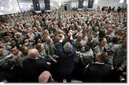 President George W. Bush reaches to shake as many hands as possible as he meets with U.S. military and diplomatic personnel Sunday, Dec, 14, 2008, at the Al Faw Palace-Camp Victory in Baghdad.  White House photo by Eric Draper