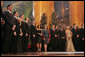 Mrs. Laura Bush joins Dr. Phil McGraw and his wife Robin, center-left, along with stage performers Sunday, Dec. 14, 2008, during the annual Christmas in Washington performance at the National Building Museum in Washington D.C. White House photo by Joyce N. Boghosian