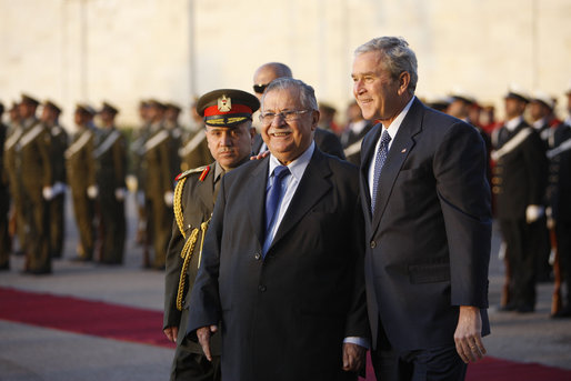 President George W. Bush walks with Iraq's President Jalal Talabani folowing his review of an honor guard upon his arrival Sunday, Dec. 14. 2008 to the Salam Palace in Baghdad, where President Bush met with Iraq's leadership. White House photo by Eric Draper