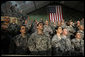 Troops at Bagram Air Base listen to remarks by President George W. Bush early Monday, Dec. 15, 2008, after his arrival in Afghanistan. The President told his audience, "I am confident we will succeed in Afghanistan because our cause is just, our coalition and Afghan partners are determined; and I am confident because I believe freedom is a gift of an Almighty to every man, woman, and child on the face of the Earth. Above all, I know the strength and character of you all. As I conclude this final trip, I have a message to you, and to all who serve our country: Thanks for making the noble choice to serve and protect your fellow Americans." White House photo by Eric Draper