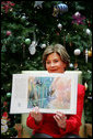 Mrs. Laura Bush shows off the illustrations in "My Penguin Osbert" Monday, Dec. 15, 2008, which she read to young patients and their families at Children's National Medical Center in Washington, D.C. Mrs. Bush explained that the book is about what you do when you write Santa a letter. Mrs. Bush also visited with patients and debuted the new Barney Cam VII: A Red, White & Blue Christmas for the kids. White House photo by Joyce N. Boghosian