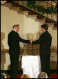 Clifton Truman Daniel, right, and Yariv Ben-Eliezer light the Menorah Monday, Dec. 15, 2008, before the annual White House Hanukkah Reception. Because the Menorah was being lit before the holiday actually begins, December 21, all eight candles, plus the Shamash -- the main candle -- were lit following a blessing. White House photo by Shealah Craighead