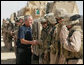 President George W. Bush visits with U.S. troops upon his arrival Sept. 3, 2007, in Al Anbar Province, Iraq. White House photo by Eric Draper