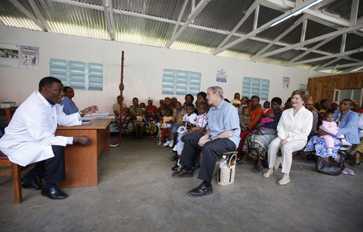 President George W. Bush and Mrs. Laura Bush join children and their families in the pediatric outpatient clinic Monday, Feb. 18, 2008, at the Meru District Hospital in Arusha, Tanzania. White House photo by Eric Draper