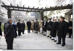 President George W. Bush stands with President Hamid Karzai of Afghanistan as he prepares to depart Kabul Monday, Dec. 15, 2008, for Washington, D.C. The President arrived in Afghanistan in the pre-dawn hours to deliver farewell remarks to the troops at Bagram Air Base and to meet with President Karzai.  White House photo by Eric Draper