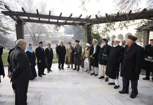 President George W. Bush stands with President Hamid Karzai of Afghanistan as he prepares to depart Kabul Monday, Dec. 15, 2008, for Washington, D.C. The President arrived in Afghanistan in the pre-dawn hours to deliver farewell remarks to the troops at Bagram Air Base and to meet with President Karzai. White House photo by Eric Draper