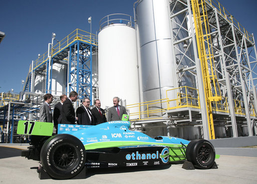 President George W. Bush is joined by officials from Novozymes North America, Inc. Wednesday, Feb. 22, 2007, as he is shown a race car that is fueled by ethanol, during his tour of the Novozymes, a biotechnology facility in Franklinton, N.C. White House photo by Paul Morse