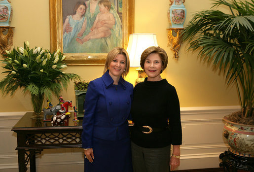 Mrs. Laura Bush poses Tuesday, Dec. 16, 2008, with Mrs. Ana Ligia Mixco Sol de Saca, wife of El Salvador's President Elias Antonio Saca, after Mrs. Saca's arrival in the Residence of the White House for a coffee. White House photo by Shealah Craighead