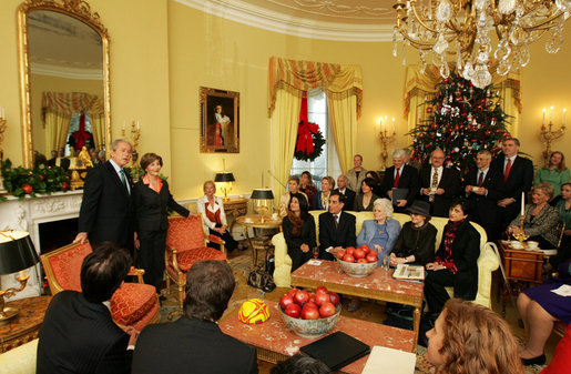 President George W. Bush and Mrs. Laura Bush stand in the Yellow Oval Room in the Private Residence of the White House Thursday, Dec. 18, 2008, after the President dropped in on a coffee in honor of the U.S. Afghan Women's Council. White House photo by Joyce N. Boghosian