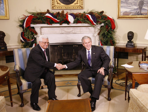 President George W. Bush welcomes President Mahmoud Abbas of the Palestinian Authority Friday, Dec. 19, 2008, to the Oval Office of the White House. White House photo by Eric Draper