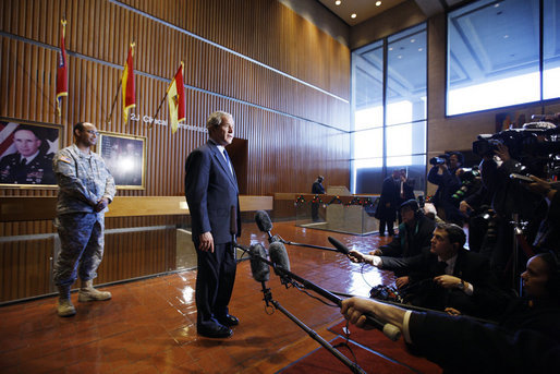 President George W. Bush addresses his remarks to reporters following his visit with wounded military personnel Monday, Dec. 22, 2008 at the Walter Reed Army Medical Center in Washington, D.C. Colonel Norvell V. Coots, Commander of the Walter Reed Health Care System, is seen in the background. White House photo by Eric Draper