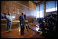 President George W. Bush addresses his remarks to reporters following his visit with wounded military personnel Monday, Dec. 22, 2008 at the Walter Reed Army Medical Center in Washington, D.C. Colonel Norvell V. Coots, Commander of the Walter Reed Health Care System, is seen in the background. White House photo by Eric Draper