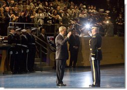 President George W. Bush salutes Col. Joseph Buche, Commander of Troops at Ft. Myer, Va., after reviewing the troops Tuesday, Jan. 6, 2009, during a military appreciation in the President's honor as Commander-in-Chief.  White House photo by Joyce N. Boghosian