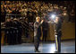 President George W. Bush salutes Col. Joseph Buche, Commander of Troops at Ft. Myer, Va., after reviewing the troops Tuesday, Jan. 6, 2009, during a military appreciation in the President's honor as Commander-in-Chief. White House photo by Joyce N. Boghosian