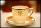 A cup from the George W. Bush State China shows the traditional eagle and the green basket-weave detail that are characteristic of the George W. Bush china unveiled by Mrs. Laura Bush, Wednesday, Jan. 7, 2009 in the Family Dining Room on the State Floor of the White House. The George W. Bush State China was inspired by a Madison-era dinner service. There are 320 place settings of the china with 14 pieces per setting. Although most Americans may use their special service a few times a year, on some days the White House may use the China services several times. White House photo by Shealah Craighead