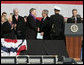 President George W. Bush shakes hands with his father, former President George H.W. Bush following President Bush's remarks in honor of his father at the commissioning ceremony of the USS George H.W. Bush (CVN 77) aircraft carrier Saturday, Jan 10, 2009 in Norfolk, Va. White House photo by Joyce N. Boghosian